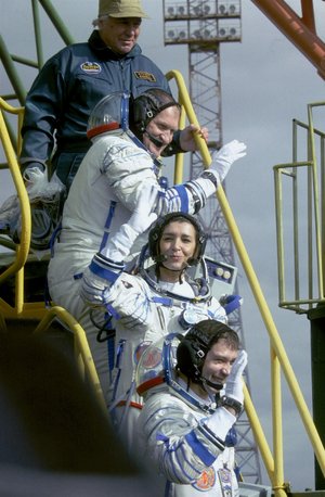 Andromède mission crew walk up the steps to the Soyuz