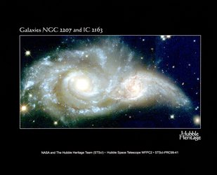 A Grazing Encounter Between Two Spiral Galaxies : Galaxies NGC 2207 and IC 2163