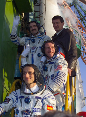 The crew of the Cervantes Mission climbs the stairs to the Soyuz TMA-3