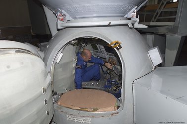 Climbing into the Soyuz simulator at Star City