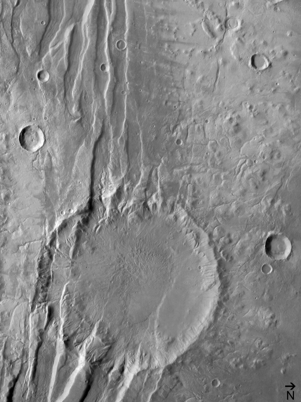 (5) Disrupted crater at Acheron Fossae in black/white