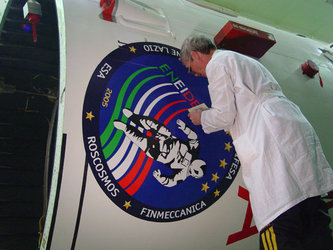 The Eneide Mission logo is placed on the Soyuz launcher