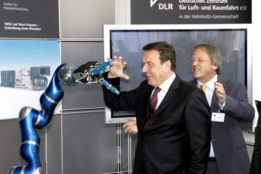 Chancellor Gerhard Schröder inspects robotic technology