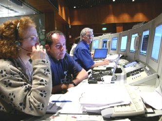 MSG-2 controllers in simulation for LEOP. Flight Director John Dodsworth is in blue shirt at right.