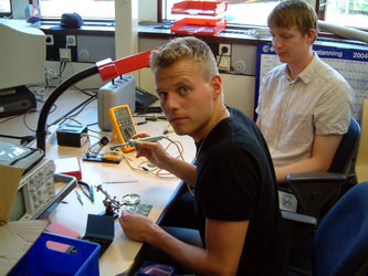 Danish students’ first attempt at soldering together components for the on-board computer