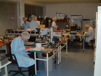 Express team working late in the ESTEC clean room integrating SSETI Express