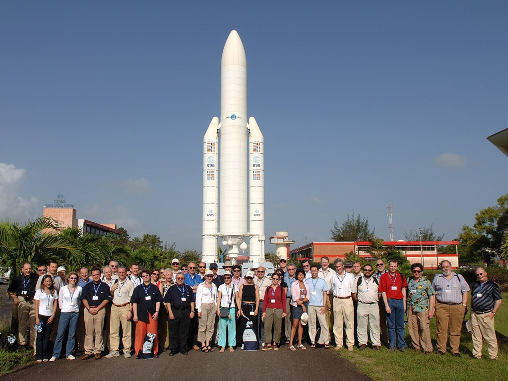 Programme board members in front of the Ariane 5 model