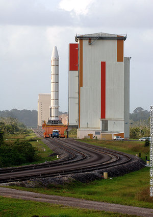 An Ariane 5 Solid Booster Stage, on a  transporter, leaves the Booster Storage Building