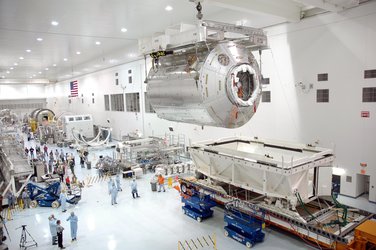 Columbus laboratory is removed from transport container at NASA's Kennedy Space Center