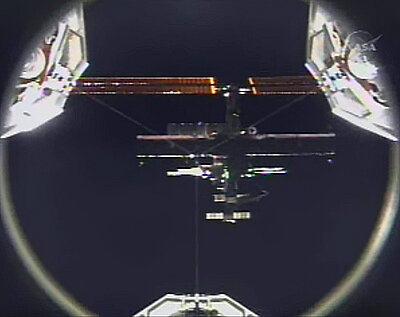 A view of ISS from Discovery as the Shuttle approaches for docking