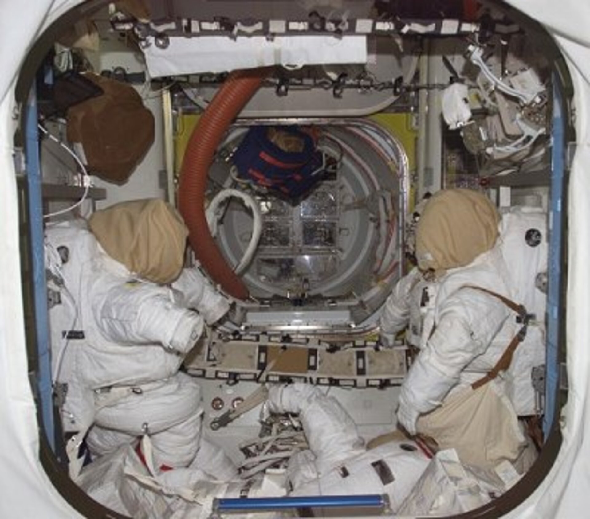 Quest Joint Airlock with two American EVA spacesuits