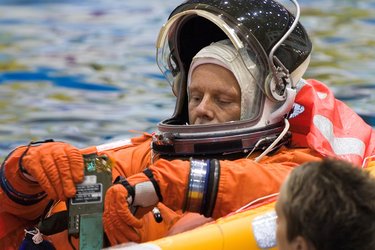 Astronaut Christer Fuglesang floats in a small life raft during an emergency bailout training session
