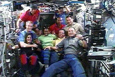 Expedition 14 and the newly arrived STS-116 crew inside the ISS
