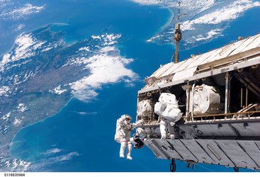 Fuglesang and Curbeam during the first spacewalk