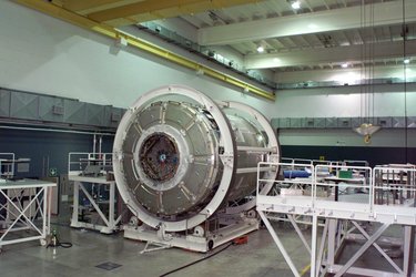 The International Space Station Node 2 module is shown in a processing facility