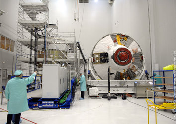 Technicians work on ATV in the S5 building at Europe's Spaceport in Kourou, French Guiana