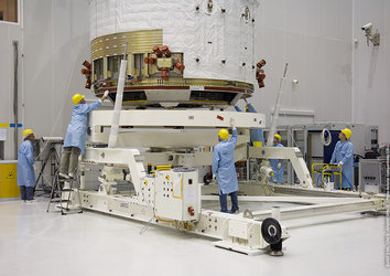 A section of Jules Verne ATV is rotated in order to attach the solar arrays to the spacecraft