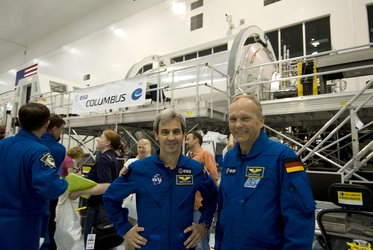 ESA astronauts Leopold Eyharts and Hans Schlegel with the European Columbus laboratory in the SSPF at KSC, Florida