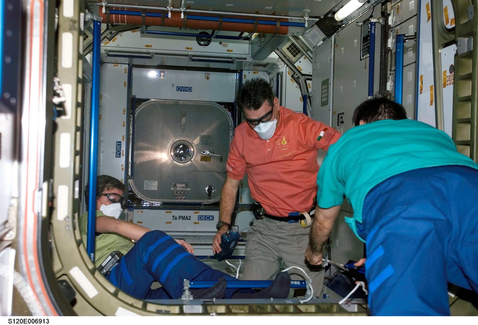 Nespoli and Whitson wore protective goggles and face masks to protect themselves in case of any loose flying objects inside the new module