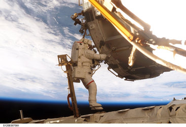 Outfitting Harmony during the STS-120 mission's second spacewalk