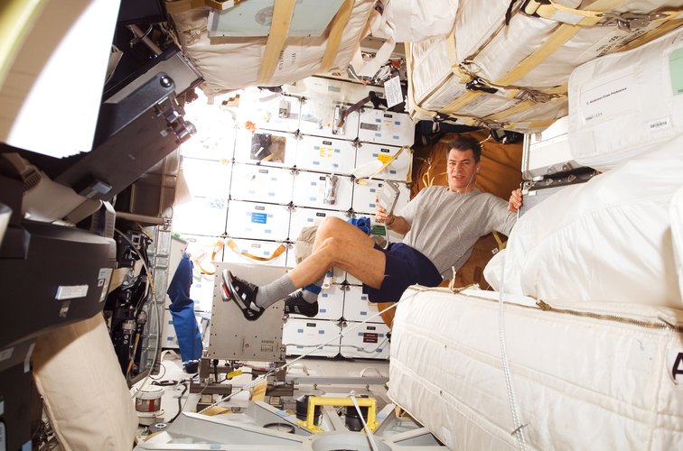 ESA astronaut Paolo Nespoli exercising during the STS-120 mission