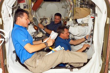 Nespoli, Parazynski and Wheelock prepare for the mission's fourth spacewalk