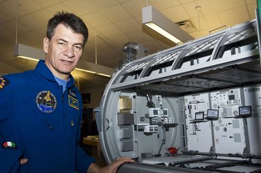 ESA astronaut Paolo Nespoli with scale model of the European Columbus laboratory