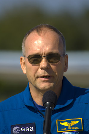 Hans Schlegel gives a brief speech after arriving at NASA's Kennedy Space Center ahead of the STS-122 mission