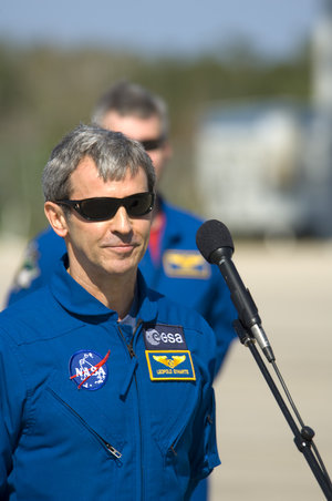 Leopold Eyharts gives a brief speech after arriving at NASA's Kennedy Space Center ahead of the STS-122 mission