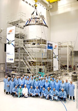 Members of the Jules Verne launch integration team in front of the spacecraft at Europe's Spaceport in Kourou, French Guiana