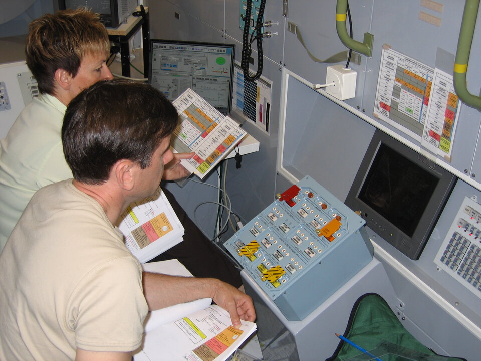 Practicing crew monitoring operations for rendezvous and docking inside the ATV mock-up at EAC