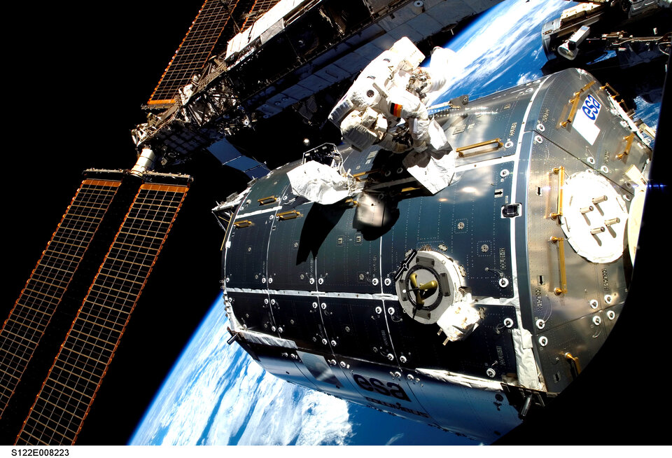Astronaut Hans Schlegel spacewalks outside Columbus