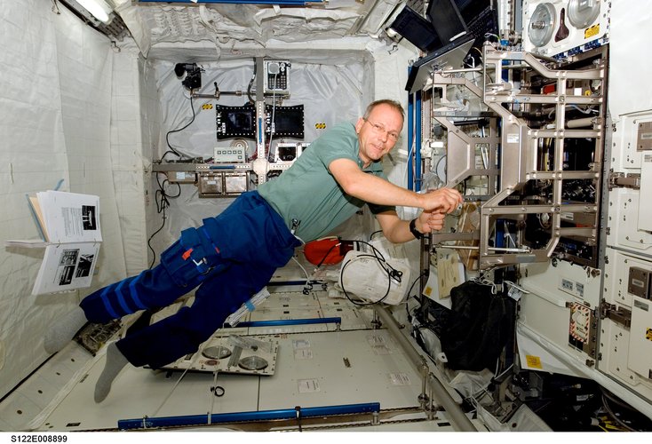 ESA astronaut Hans Schlegel works toward readying the European Columbus laboratory