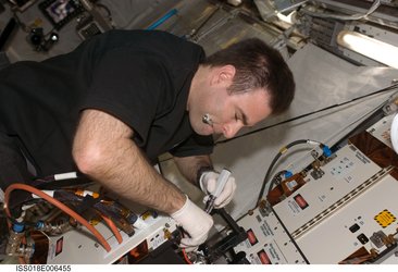 Chamitoff works on a facility inside the Columbus laboratory