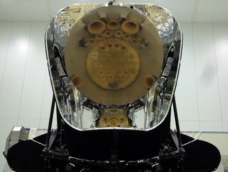 Planck instruments reflected in the telescope primary mirror