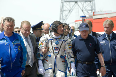 Russian cosmonaut Roman Romanenko prepares to take the elevator to the top of the Soyuz rocket
