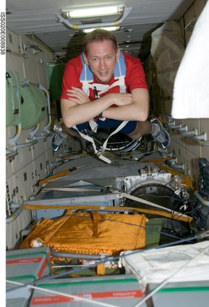 ESA astronaut Frank De Winne floats through the Zarya module