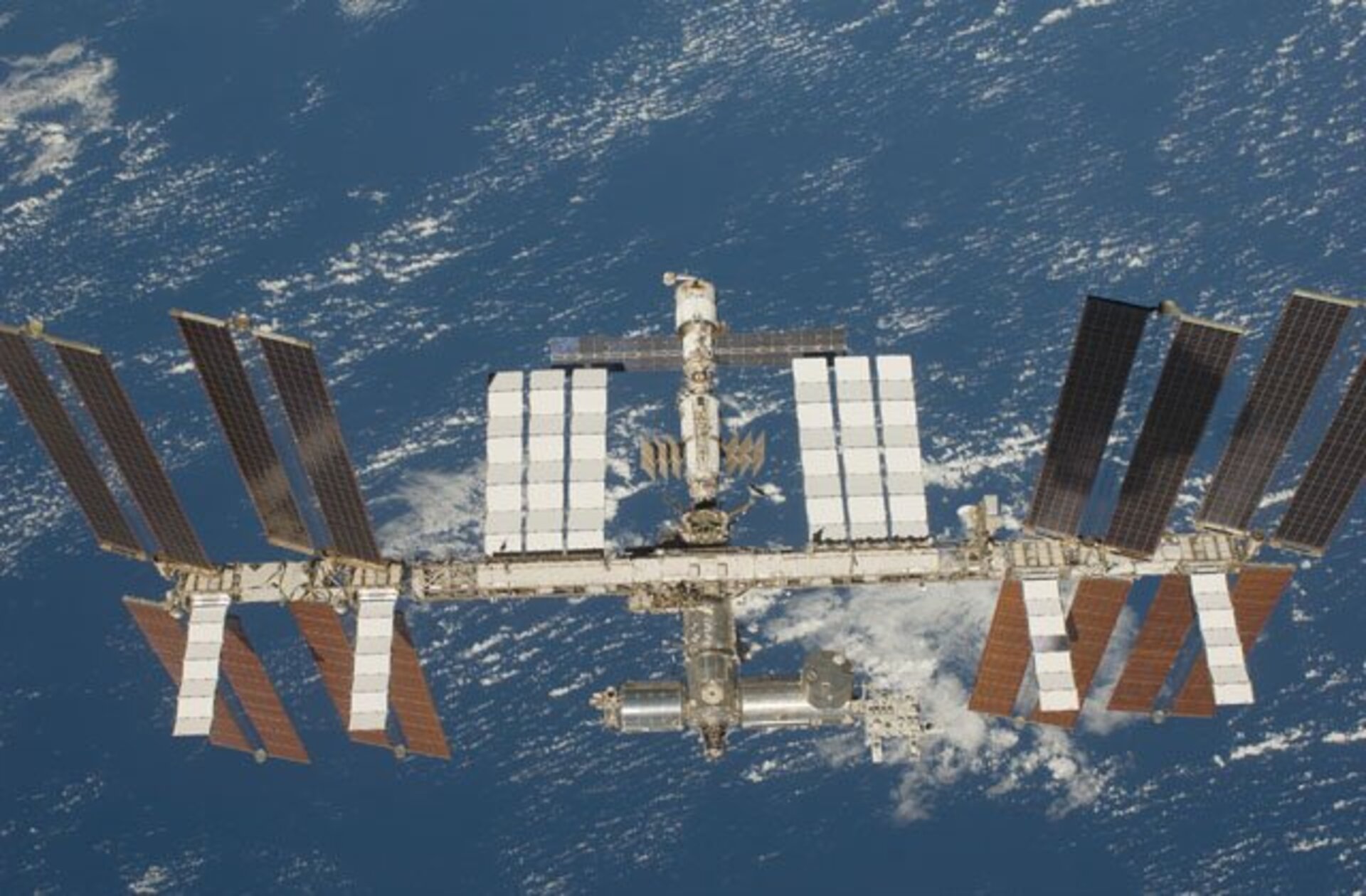 The International Space Station back dropped by Earth