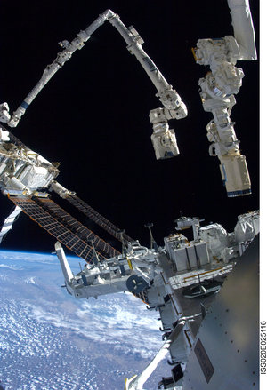 Portion of the Japanese Experiment Module - Exposed Facility and the Space Station and Shuttle robotic arms