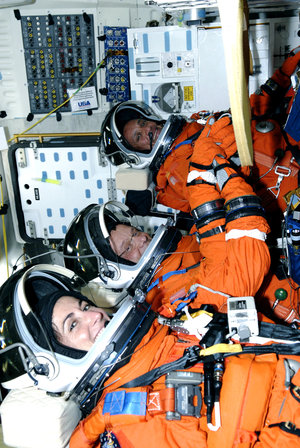 STS-128 crewmembers seated inside Discovery for simulated launch countdown