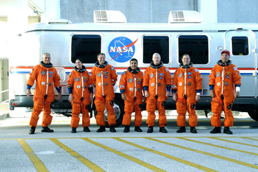 Suited STS-128 crewmembers make their way to the launch pad for simulated launch countdown