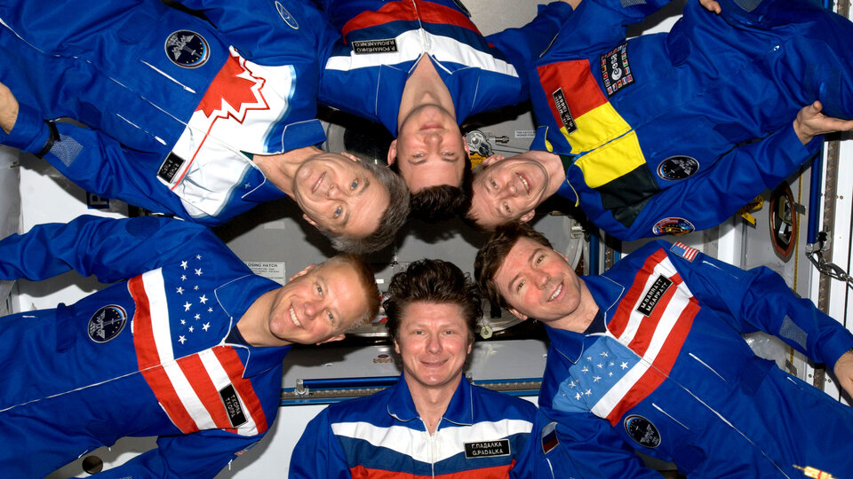 Expedition 20 crewmembers pose in 'star-burst' formation for an inflight portrait