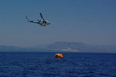 Helicopter flying over the liferaft