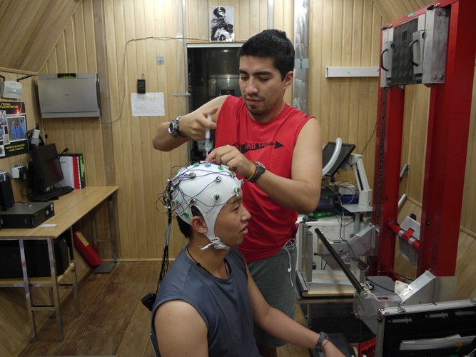 EEG electrode cap being installed