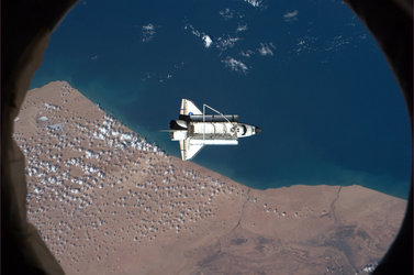Discovery, over southern Morocco during the ISS fly around before departure