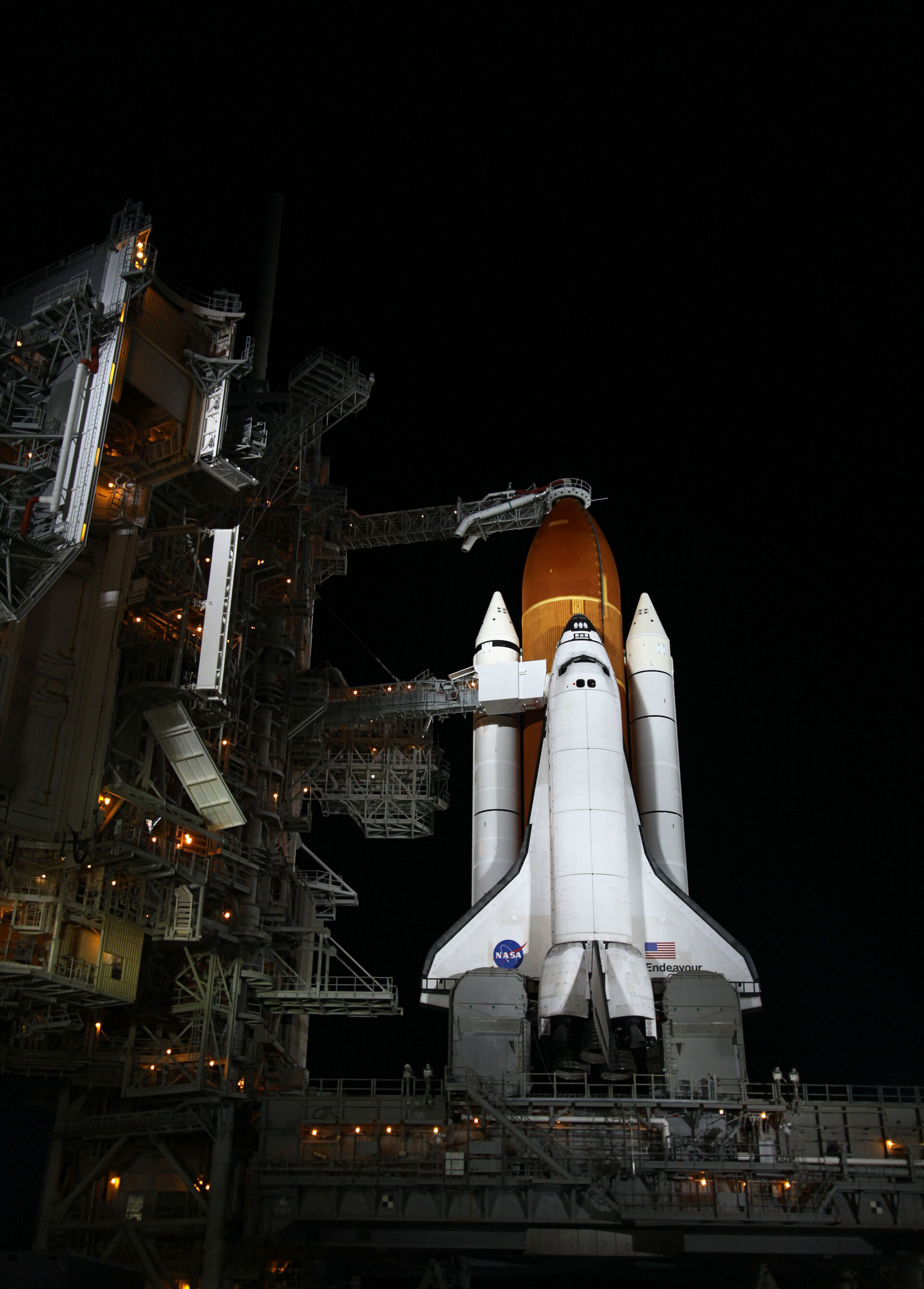 Endeavour illuminated by bright xenon lights