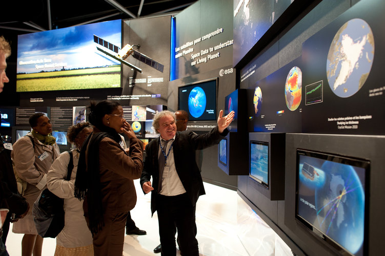 Staffs of the Europe's Spaceport and Dominique Detain visit the ESA pavilion