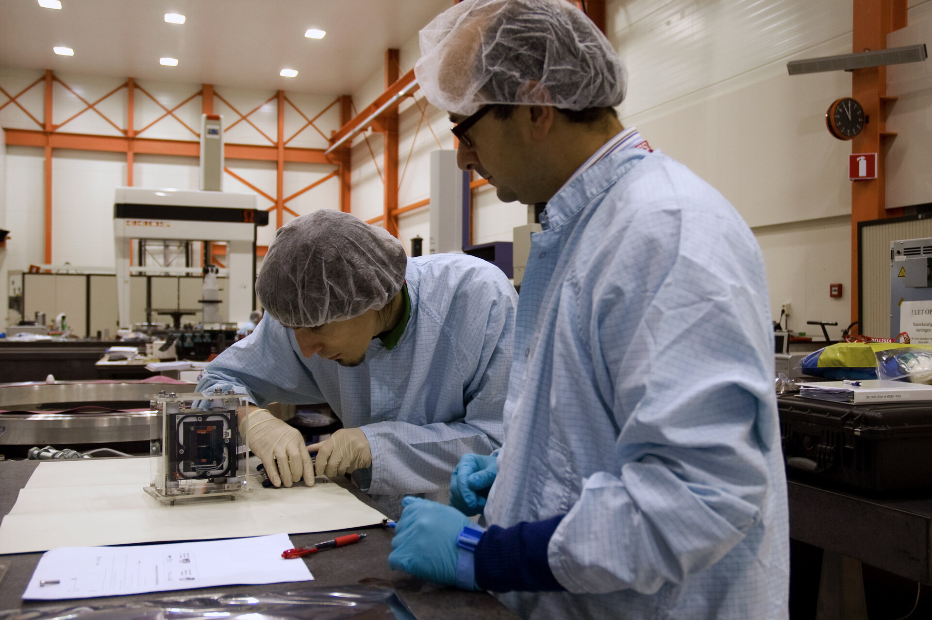 The Xatcobeo team unpack their CubeSat for inspection