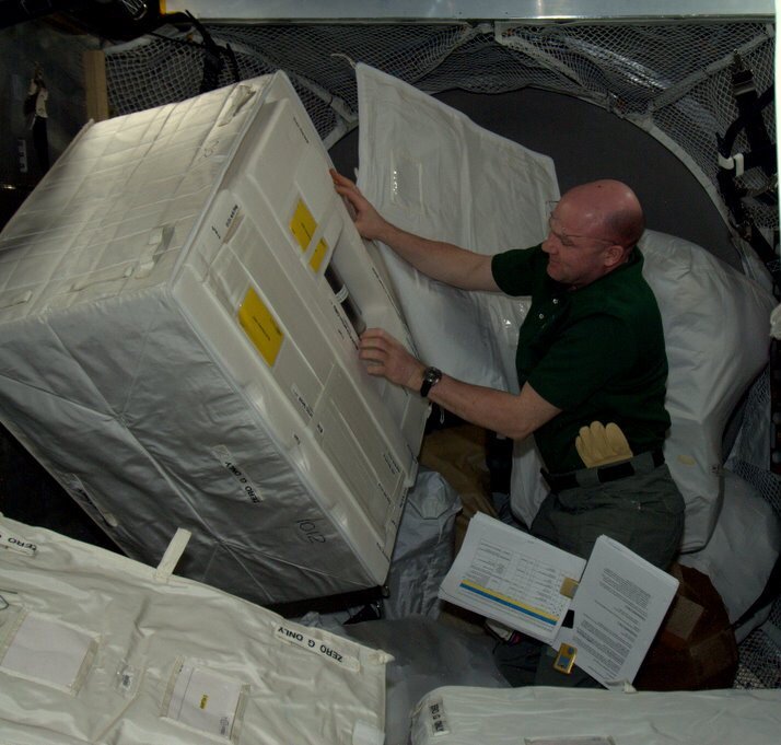 André Kuipers unloading ATV-3 cargo