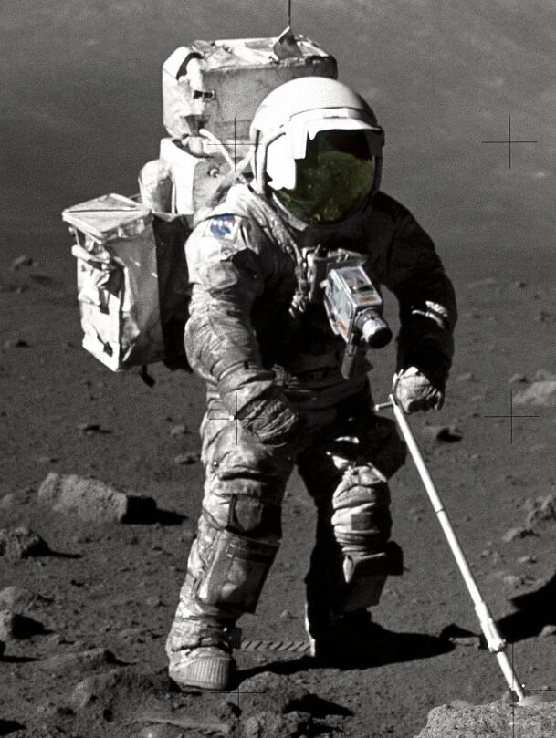 Apollo astronaut collecting dust samples